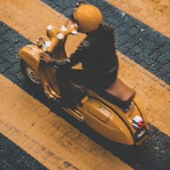 An image of a person riding a Scoot